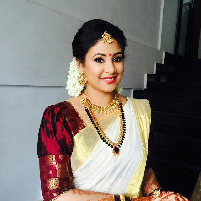 Kerala saree with maroon blouse
