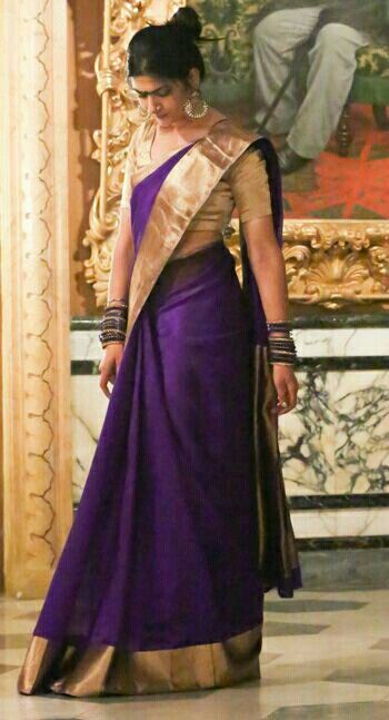 purple saree with gold blouse