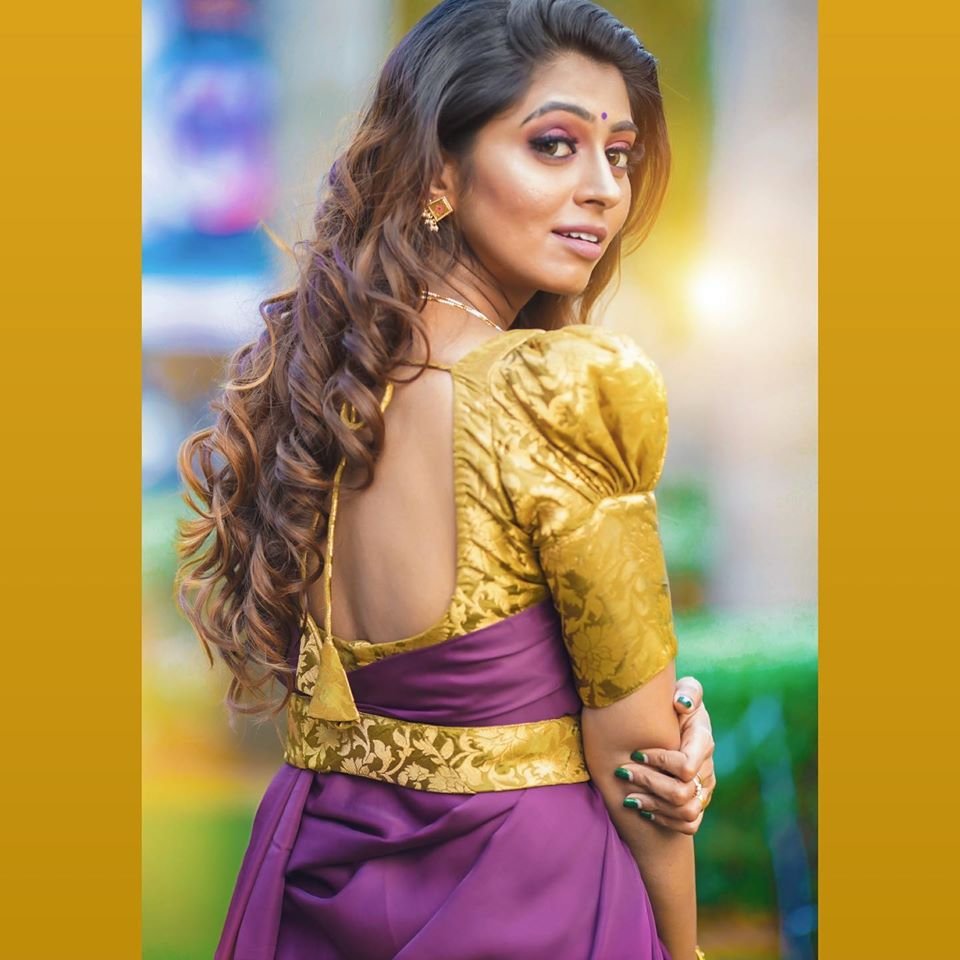golden blouse with purple saree