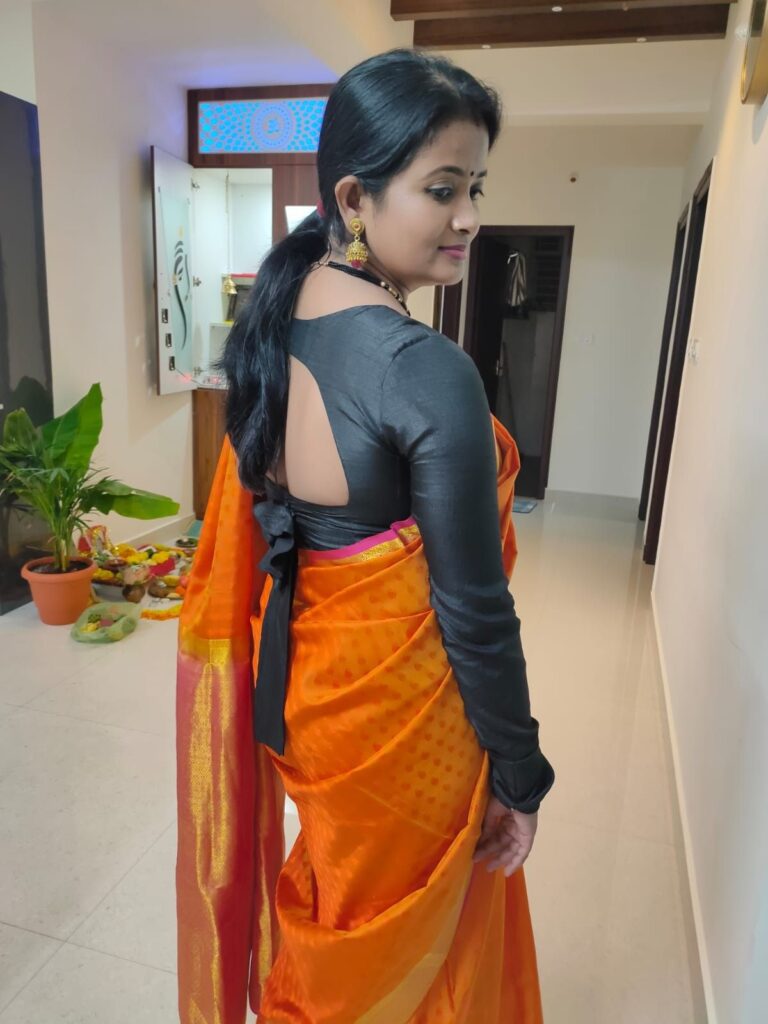 Orange Saree with Plain Black Blouse